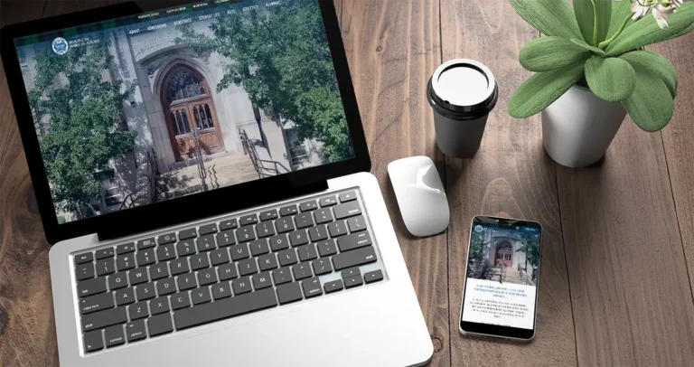 Picture of a laptop computer and cellphone on a desk with the new Mount St Mary Academy website on their screens.